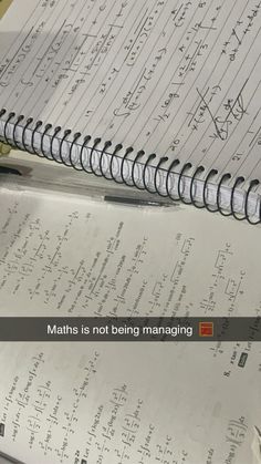 a notebook with some writing on it and a pen next to it that says maths is not being managing