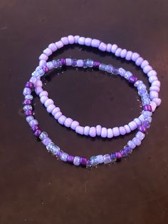 These handmade purple bracelets are just full of bright color!  Either one is sure to please any purple lover like myself!  Whether you decide on the light purple, shades of purple, or stack them both, I'm sure they will look gorgeous on you!  Very nice, bright colors. They compliment each other well.  Simple, but still adds color to any outfit! Adults and kids sizes available! Purple Round Beads Bracelet For Beach, Handmade Adjustable Purple Bracelets, Handmade Adjustable Purple Bracelet, Trendy Purple Friendship Bracelets As Gift, Purple Bracelet Jewelry For The Beach, Purple Bracelet Jewelry For Beach, Handmade Purple Bohemian Stretch Bracelet, Adjustable Lavender Beaded Bracelets, Trendy Style, Adjustable Lavender Beaded Bracelet, Trendy Style