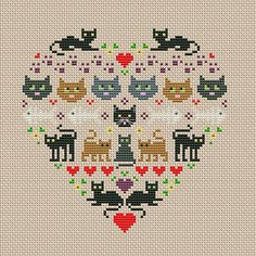 a cross stitch heart with cats and hearts on it