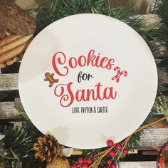 a white plate with cookies for santa written on it