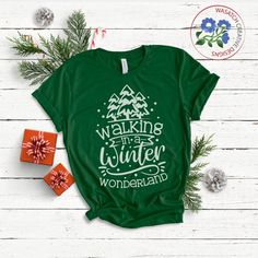 a green shirt that says walking the winter wonderland