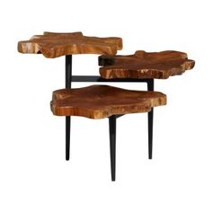 two tables made out of wood with black legs and one is shaped like a tree trunk