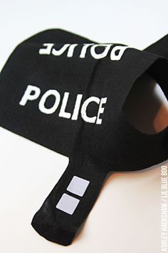 a black mask with the word police written on it