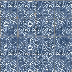 a blue and white tile with an intricate design