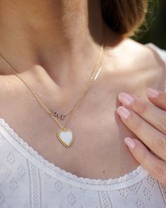 DETAILS This lovely white enamel heart necklace is guaranteed to put a smile on your face. We love it layered with other gold necklaces, or wear it solo with a cozy v-neck cardigan. 14k gold plated silver Circular clasp Charm diameter: approx. 3/4" Chain length: 16” + 2" extension Heart Necklace With Charm For Layering, Everyday White Heart Necklace With Delicate Chain, Dainty White Heart Pendant Necklace, Trendy White Heart Charm Necklace, Dainty White Heart-shaped Necklace, White Personalized Dainty Heart Necklace, Trendy White Necklace With Heart Charm, Dainty White Heart Necklace With Delicate Chain, White Dainty Everyday Necklace