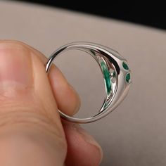 This is a gorgeous handmade creation. Its beauty is its simplicity & Elegance. The 6*6mm round shape faceted lab emerald is crafted in solid sterling silver and with rhodium plated. All item is sent in a beautiful gift box If you have any idea of design your ring,pls contact me directly. You can realize more lovely stuff clicking the link https://www.etsy.com/shop/knightjewelry?refshopsection_shophome_leftnav Please leave the correct address and you phone number for delivering successfully. Emerald Jewelry For Promise Ring With Polished Finish, Sterling Silver Emerald Ring With Bezel Setting, Emerald Diamond Promise Ring, Solitaire Round Emerald Ring For Promise, Round Solitaire Emerald Promise Ring, Silver Emerald Ring With Bezel Setting, Emerald Crystal Ring In Fine Jewelry Style, Fine Jewelry Emerald Crystal Ring, Round Cut, Sterling Silver Open Emerald Ring As Birthstone