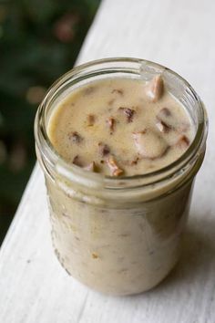 a jar filled with food sitting on top of a table