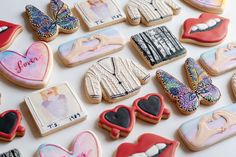 many decorated cookies are arranged on a table