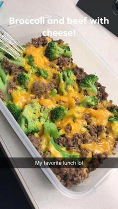 broccoli and beef with cheese is in a plastic container on the counter top