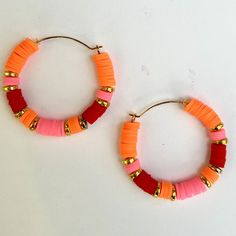 "These colorful hoop earrings are made from polymer clay heishi beads.  They are available in endless color combinations which you can choose at checkout.  This pair is the large sized hoop, 1 5/8\" diameter. This listing is for the earring shown in the first photo. this pair is vibrant in red, pink and orange. you can have them as is or choose your colors.  Choose any colors you like to match an outfit or your mood.  Don't see what you want?  Message me." Handmade Red Hoop Earrings For Beach, Trendy Red Beaded Earrings For Beach, Pink Hoop Earrings With Colorful Beads For Beach, Trendy Handmade Orange Hoop Earrings, Pink Playful Handmade Hoop Earrings, Hoop Earrings Large, Bead Hoop Earrings, Earrings Large, Earrings Red