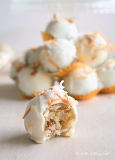 some kind of dessert with white frosting and orange sprinkles