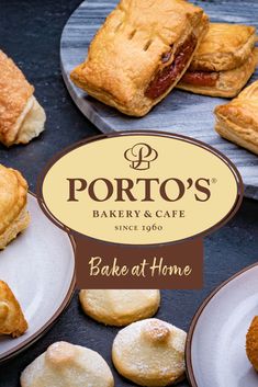 some pastries are sitting on plates next to the sign for portto's bakery and cafe