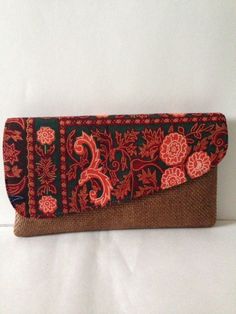 African hand made high quality clutch made from local materials and African print material. Clutches could be used for night out, casual day out, bridesmaid party gifts, etc. Different colors available upon orders. Red Rectangular Clutch For Festivals, Bohemian Red Handmade Clutch, Handmade Bohemian Red Clutch, Red Bohemian Handmade Clutch, Handmade Red Bohemian Clutch, Bohemian Green Clutch As Gift, Red Bohemian Clutch, Rectangular Brown Clutch For Wedding, Brown Rectangular Clutch For Wedding