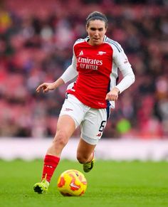 a female soccer player in action on the field