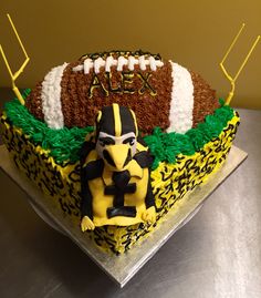 a football themed cake on a table