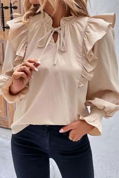 Elevate your style with our Women's New Ruffled Long Sleeve Solid Color Blouse. This chic blouse seamlessly blends fashion and elegance. With its stylish ruffled details and classic solid color design, it's the perfect choice for a sophisticated and timeless look. Upgrade your wardrobe with this fashionable and versatile addition, suitable for various occasions and seasons. Chic Tops With Ruffle Hem And Lantern Sleeves, Lantern Sleeve Top With Ruffles For Brunch, Beige Ruffle Sleeve Top For Fall, Casual Beige Blouse With Ruffle Hem, Solid Ruffled Tops For Fall, Beige Puff Sleeve Top With Ruffles, Chic Blouse With Ruffle Hem And Lantern Sleeves, Chic Blouse With Lantern Sleeves And Ruffle Hem, Fall Ruffle Hem Blouse With Ruffle Sleeves