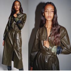 a woman in a green leather trench coat