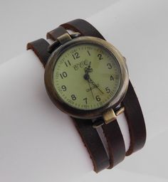 This is a wrap style watch. The case is bronze color metal alloy, free of nickel and lead, round 1.25 inches diameter. The quadrant is vintage style, greenish cream color with numerals. The bracelet will be custom made in crazy-horse distressed finish brown leather 6mm wide. Choose the measure of your wrist and the bracelet will be made with a length 3 times your wrist plus 3/4 inch for room. The closure is a magnetic clasp also made in bronze finish metal alloy. free of nickel and lead. The sty Bracelet Pack, Watch For Women, Style Watch, Women's Watches, Wrap Watch, Leather Wraps, Brown Fashion, Bronze Color, Fashion Watches