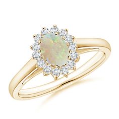 an opal and diamond ring in yellow gold