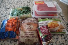 several bags of food sitting on top of a counter