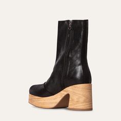 This sleek, simple design features a cushioned chunky clog base for ultimate comfort. The black cracked leather adds a touch of sophistication and texture, making the Bobbie an elegant yet edgy choice for versatile wear. Step confidently in style and comfort with this standout clog boot.Ethically made in Portugal, designed in Sweden. Heel height 8 cm/ 3.14 in Shaft height 19 cm/ 7.5 in shaft circumference 28 cm 11 in True to size Modern Black Platform Boots, Sleek Leather Platform Boots With Block Heel, Sleek Leather Platform Boots With Stacked Heel, Sleek Leather Platform Boots Medium Width, Modern Leather Platform Boots With Stacked Heel, Modern Leather Platform Boots With Block Heel, Modern Leather Platform Boots With Sculpted Heel, Black Leather Platform Boots With Stacked Heel, Sleek Leather Platform Boots With Round Toe