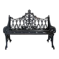 an iron bench with ornate carvings on it's back and arms, isolated against a white background