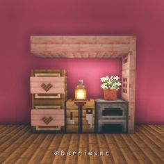 a room with pink walls and wooden floors