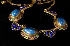 "This is a very beautiful, old and unique  ART DECO CZECH MAX NEIGER ART GLASS ENAMEL BRASS c. 1920 choker necklace. The necklace has a marvelous Art Deco shape with cabochon blue lazurite lapis, cobalt, green enamel decoration and brass. It measures 16\" long and 3/4\" wide. The necklace is in very good condition. 0.7 LT" Art Deco Choker, Art Deco Cabochon Pendant Jewelry, Antique Blue Brass Necklace, Antique Blue Brass Jewelry, Art Deco Blue Pendant Necklace, Vintage Formal Jewelry With Inlay, Formal Vintage Jewelry With Inlay, Unique Gold Necklace With Inlay, Handmade Art Nouveau Brass Jewelry