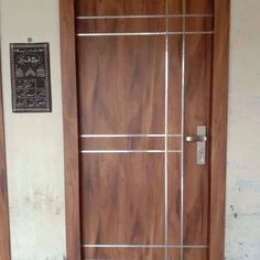 a wooden door with metal bars on it