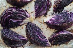 purple cabbage cut in half on a baking sheet