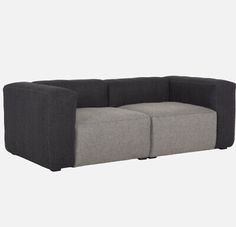 a gray and black couch sitting on top of a white floor