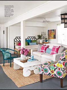 a living room filled with furniture and colorful pillows