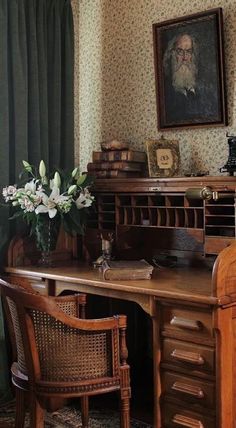 an old fashioned desk and chair in a room