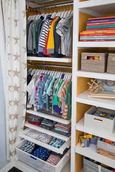 an organized closet with clothes and other items