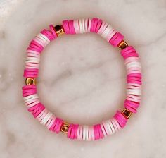 Hot pink, light pink, and white flat circle beads with gold beads. Fits all sizes. Cheap Pink Polymer Clay Beaded Bracelets, Hot Pink Bracelet, Ruby Bracelet, White Flat, Pacific Palisades, Bracelet Ideas, White Flats, Pink Bracelet, Pink Light