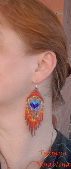 These handmade earrings in the form of peacock feathers are made of high-quality Czech beads and strong synthetic thread. In these unique earrings I use my author's scheme .They are elegant, fashionable, and highly versatile, suitable for everyday wear.Peacock is considered to be more of a talisman of glory. 100% hand made with love! Copy without my permission is prohibited Measurements: Long earrings: Length-about 11.5cm (4.5 inch)Width -about 3 cm (1,18 inch) Medium earrings: Length-about 9.5c Iridescent Earrings, Earrings Bird, Peacock Feather Earrings, Peacock Earrings, Animal Totem, Hippie Earrings, Bird Earrings, Eye Earrings, Peacock Feathers