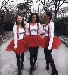 three women dressed in red tutu skirts and white shirts