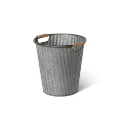 a metal bucket with rope handles on an isolated white background for use in interior design