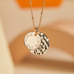 Our Personalized Hammered Double Disc Necklace suits any style and occasion, hand-engraved with special names, dates or messages.18K Champagne Gold Plated, 925 Sterling Silver or 18K Rose Gold PlatedHammered disc charm: 0.8”x0.8”, smooth disc charm: 0.6”x0.6”Charms are removable from this chain and can be worn on all Merci Maman chain lengthsEngrave up to 20 charactersEngraving on smooth charm onlyHand-engraved in our Paris workshopSent with love in a complimentary gift boxAny slight variations Hammered Necklace, Gold Disc Necklace, Small Charms, Hand Stamped Jewelry, Disc Necklace, Engraved Necklace, Stamped Jewelry, Champagne Gold, Metal Necklaces