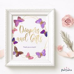 there is a frame with some flowers and butterflies in the frame on top of it