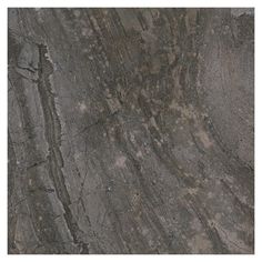 a close up view of the surface of a granite slab with cracks and scratches on it