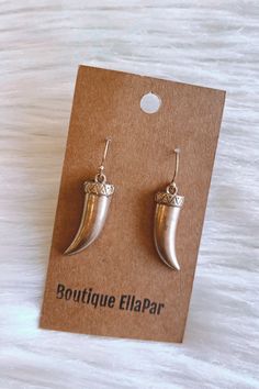 Boho inspired, horn earrings. These worn, golden, earrings are metal and feature a fish hook backing. Lightweight and small in size. Brass Jewelry With Fish Hook For Gift, Trendy Pierced Brass Earrings, Unique Metal Drop Cartilage Earrings, Trendy Brass Earrings For Pierced Ears, Metal Fish Hook Earrings, Bohemian Drop Earrings With Fish Hook, Trendy Silver Brass Earrings, Trendy Handmade Brass Earrings, Trendy Metal Earrings For Festivals