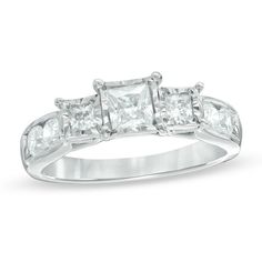 a three stone ring with princess cut diamonds