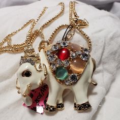 Beautiful Elephant Pendent With A Long Necklace. Not Marked. White Pendant Necklace For Party, White Pendant Necklace Costume Jewelry, White Metal Pendant Necklace, White Metal Necklace With Round Pendant, White Metal Jewelry With Large Pendant, White Long Necklace With Large Pendant, White Metal Long Necklace, White Long Metal Necklace, White Metal Necklace With Large Pendant