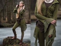 a woman dressed in green is talking on her cell phone while standing next to a river