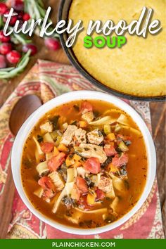 turkey noodle soup in a white bowl next to a casserole dish