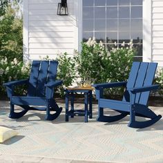 three chairs and a table on a patio