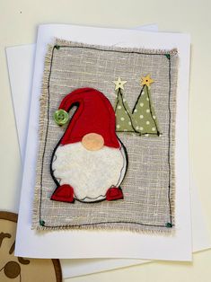 a christmas card with an image of a gnome