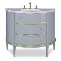 a bathroom vanity with marble top and two faucets on the bottom, in blue