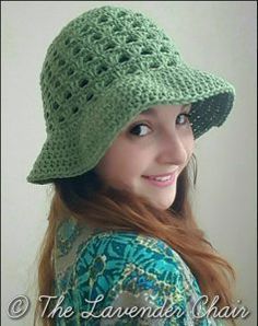 a young woman wearing a green crochet hat